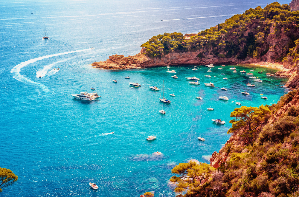 Cala Futadera, a turquoise bay filled with boats