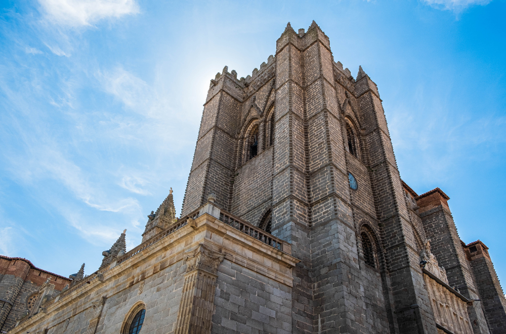 Close-up of Ávila Cathedral's imposing stone tower