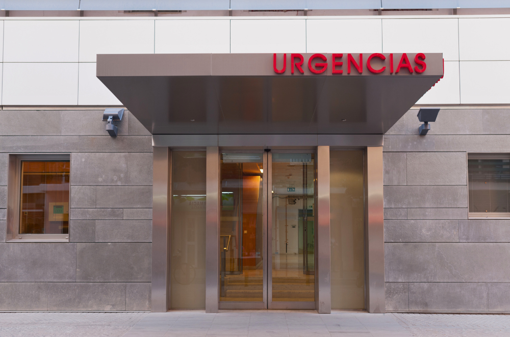 Entrance to a Spanish hospital emergency room with "Urgencias" sign