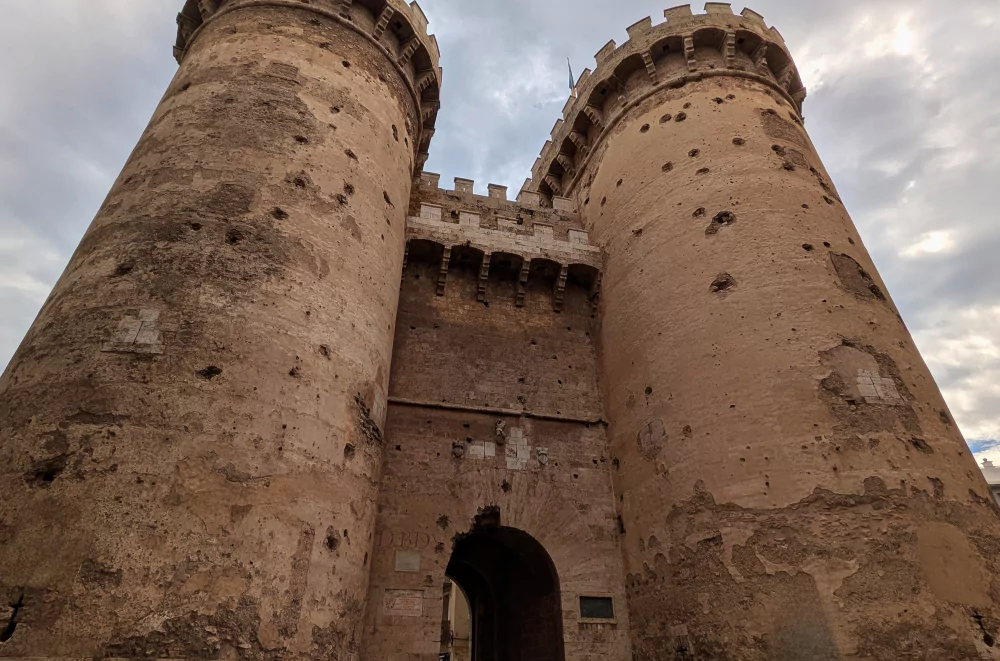 Torres de Quart in Valencia old town, showing battle scars from Napoleon's siege with its iconic twin towers and medieval architecture