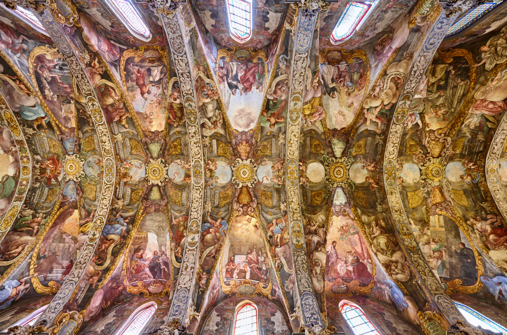 Baroque frescoes covering the ceiling of Church of San Nicolas in Valencia old town, known as Valencia's Sistine Chapel, with intricate religious scenes and golden ornaments